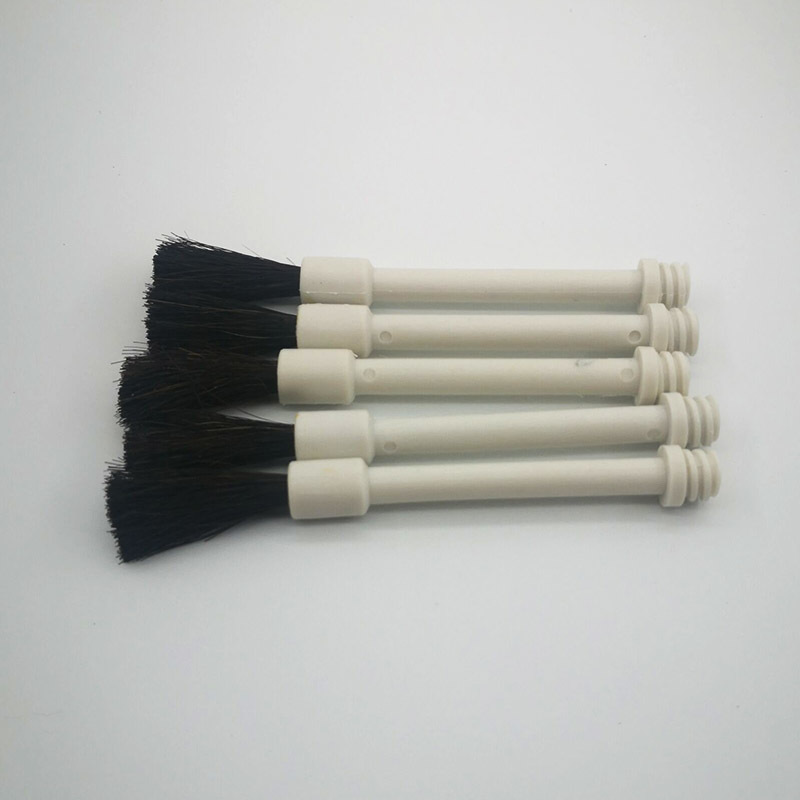 A smear brush. bottle cap brush