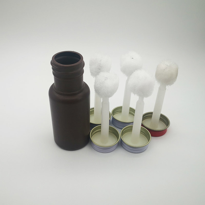 A smear brush. bottle cap brush