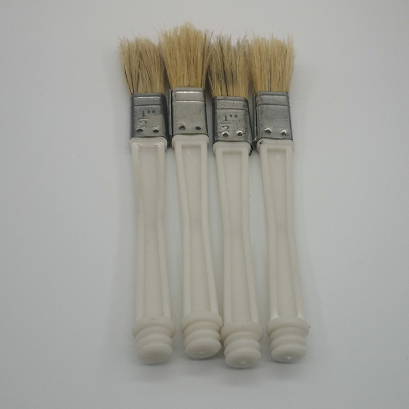 A smear brush. bottle cap brush