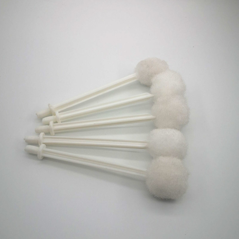 A smear brush. bottle cap brush