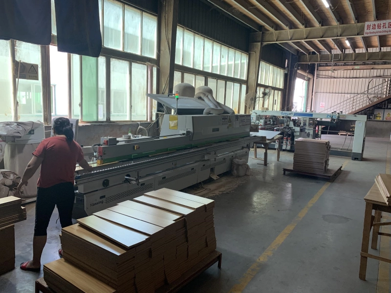 Drilling and edge banding of wooden boards, hardware assembly, spraying of wooden feet, and assembly of bed sides Drilling and edge banding of wooden boards, hardware assembly, spraying of wooden feet, and assembly of bed sides
