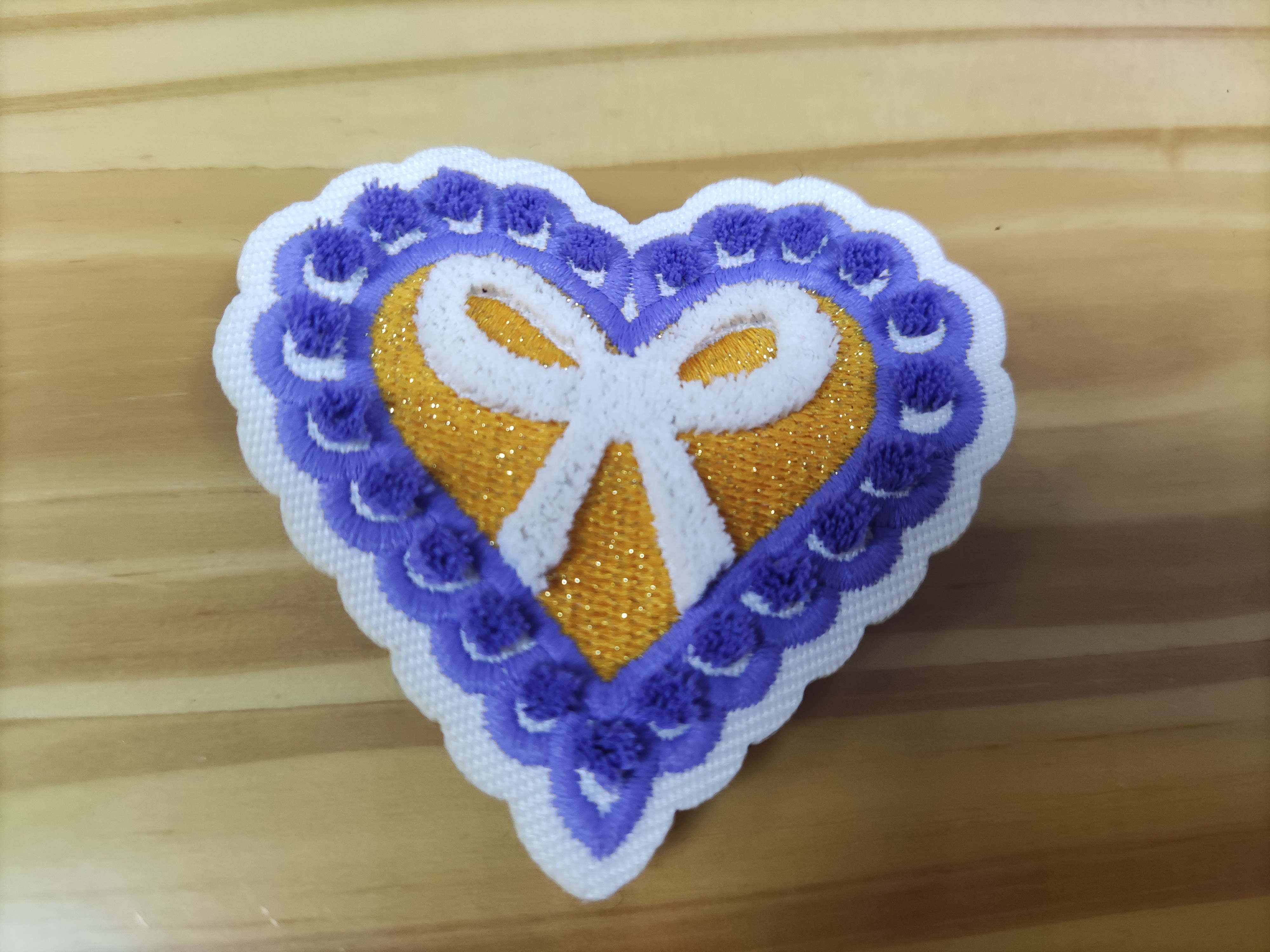 Heat transfer embroidered patches with adhesive backing Heat transfer embroidered patches with adhesive backing