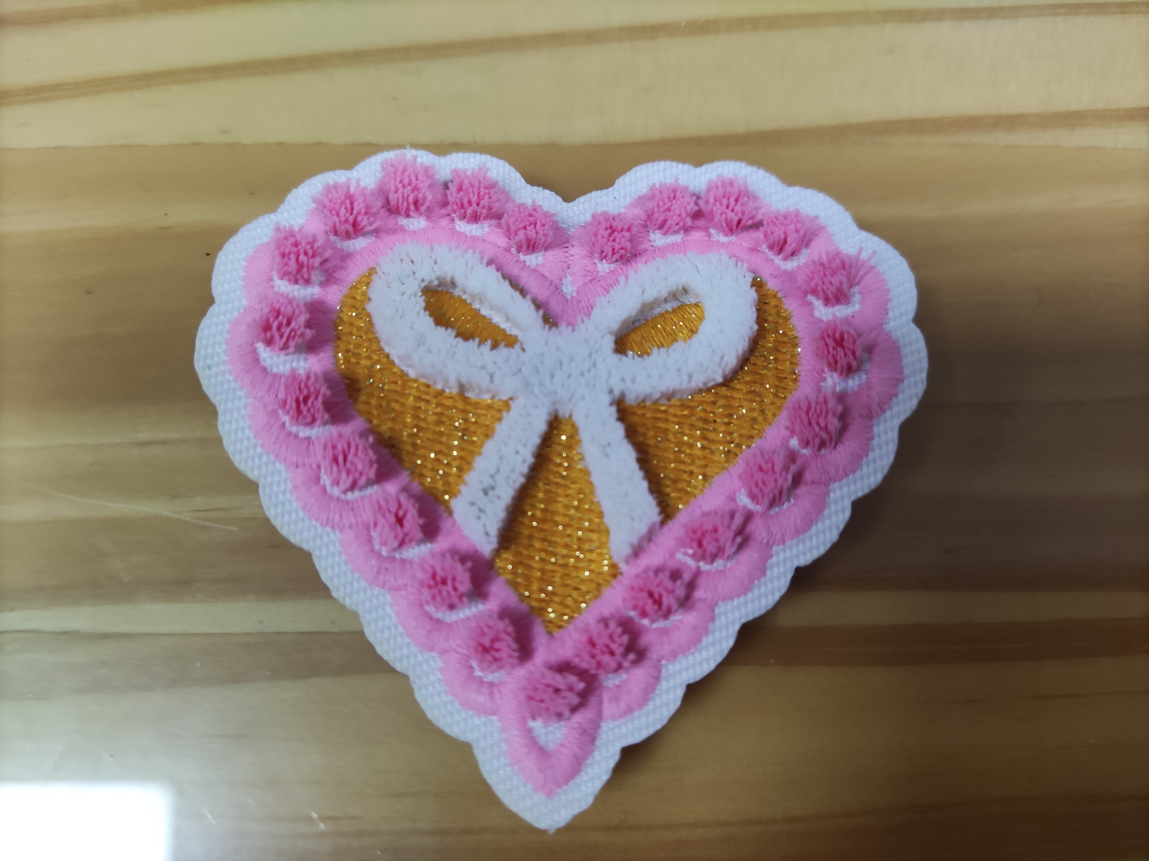 Heat transfer embroidered patches with adhesive backing Heat transfer embroidered patches with adhesive backing