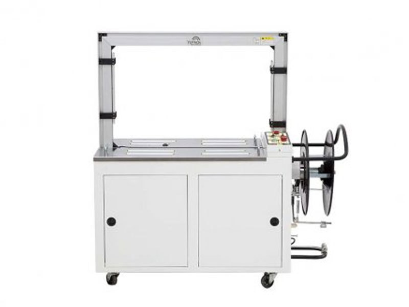 Pressurized strapping machine