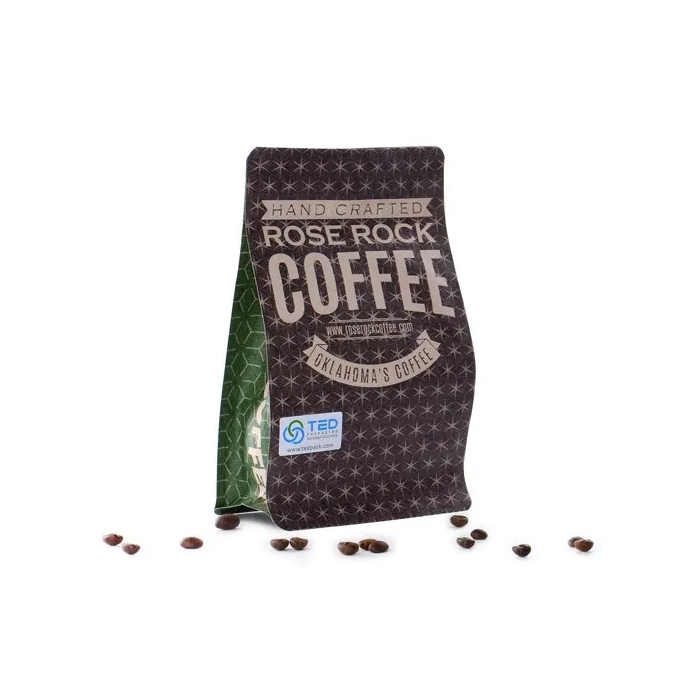 The material requirements for baking coffee packaging bags typically include a combination of aluminum foil and kraft paper. The aluminum foil provides a barrier to light, moisture, and oxygen, while the kraft paper provides durability and sturdiness. This combination ensures that the coffee beans are protected from external elements that could compromise their freshness and flavor. Additionally, the bags should have a resealable zipper to allow for easy opening and sealing to maintain the coffee's quality after the initial opening. The overall design should be visually appealing and include relevant information about the coffee blend, roast level, and origin.