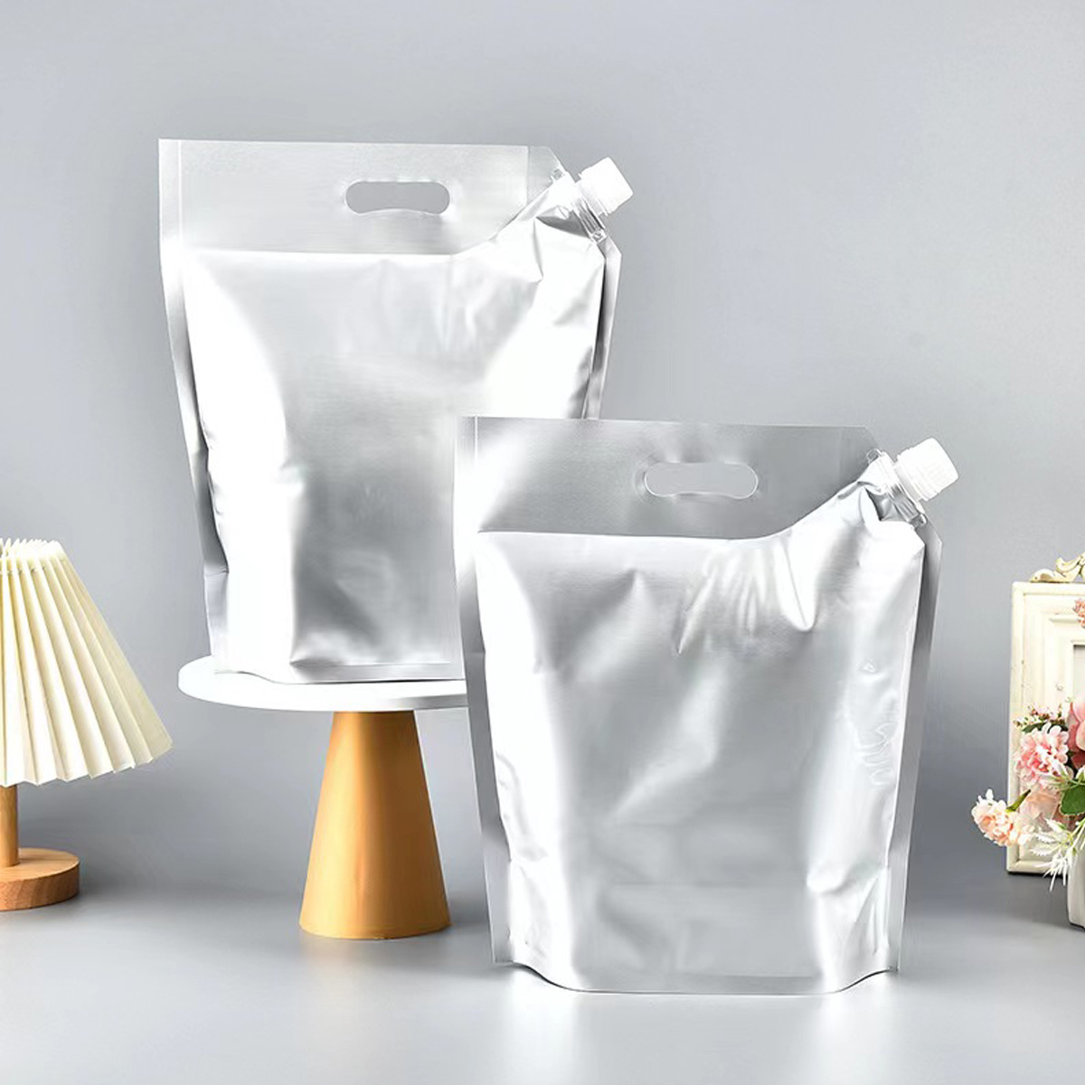 Aluminum foil spout bags are commonly used for packaging various liquid products such as beverages, sauces, and oils. These bags are designed with a spout for easy pouring and a resealable cap to keep the contents fresh and prevent spills. The aluminum foil material provides excellent barrier properties, protecting the product from light, moisture, and oxygen, ensuring longer shelf life. The spout bags are also lightweight and durable, making them ideal for on-the-go consumption and convenient storage. Overall, aluminum foil spout bags are versatile and practical packaging solutions for a wide range of liquid products.

 

We are a manufacturer that specializes in producing customized aluminum foil spout pouches. Our production capabilities allow us to accommodate various requirements and specifications for our customers. Whether it's a specific size, shape, design, or printing requirement, we have the flexibility to tailor our products to meet your needs. With our expertise and experience in the industry, we can provide high-quality aluminum foil spout pouches that are durable, functional, and visually appealing. Contact us today to discuss your custom packaging needs and let us help you create the perfect solution for your product.
