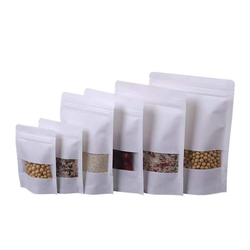 Regardless of whether it is printed or not, the white kraft paper stand-up pouch with window and zipper that you see is a customized product. Our kraft paper has a universal thickness of 28 microns on both sides. You can tell us your specific requirements. Please refer to the next text for more details.
Window kraft paper packaging bags offer a visual advantage by allowing customers to see the product inside, making it more attractive and appealing. The zip-lock self-sealing feature ensures convenience and security, keeping the contents fresh and protected. The easy-tear notch provides easy access to the product without the need for scissors or other tools. Additionally, the stand-up bottom design offers stability and allows the bag to stand upright, making it easier to display and store. With these features, window kraft paper packaging bags are not only practical but also visually appealing and user-friendl
The white color gives it a clean and sophisticated look, perfect for showcasing a variety of products. The stand-up design makes it easy to display on shelves or countertops, while the zipper closure ensures that contents are securely stored. This bag combines beauty and functionality, making it an ideal packaging solution for a wide range of items.
These pouches can be customized to fit your specific size requirements, making them perfect for packaging a wide range of products. Additionally, they can be printed with your logo or branding, helping to create a professional and cohesive look for your products. Whether you're packaging snacks, cosmetics, or any other type of product, our white stand-up kraft paper zipper pouches are the perfect choice.
The white kraft paper stand-up zipper bag is ideal for packaging a variety of products. Its durable construction and stand-up design make it suitable for packaging items such as snacks, candy, nuts, coffee beans, tea leaves, dried fruits, cookies, chocolates, and other small food items. The zipper closure ensures the contents remain fresh and secure, making it a perfect choice for storing and transporting perishable goods. The transparent window on the bag allows for easy viewing of the contents, making it an attractive option for showcasing the products inside. Overall, this bag is versatile and practical for packaging a wide range of products in a stylish and convenient way.