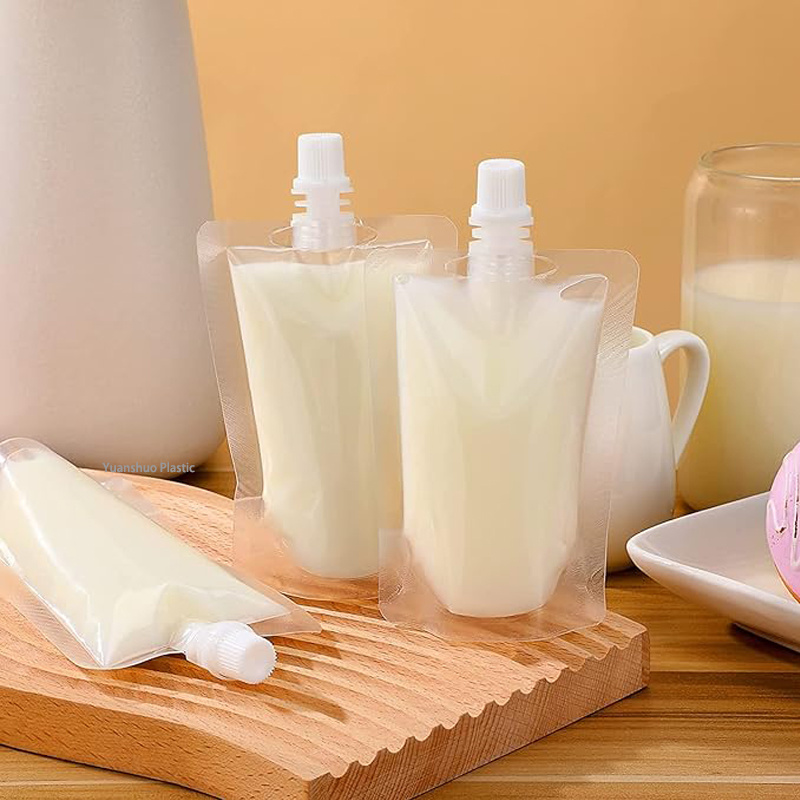 Plastic stand up drinking spout bags. The spout bag has a positive seal spout, it is freezable and perfect for any liquid, excluding hot.Spout bags have lids, food grade, waterproof, ideal for wine, juice, oil, beverage, ect. Clear bags allow you to have a clear mind of what you have stored in them. Round Corners for Safety, The reclosable lid ensures easy opening and no leaking accidents.These pouches are portable, they have lid, stand up on their own when filled, and can be flattened for storage. They are ideal for vacations, taking to lunch, or giving out drinks to go.
