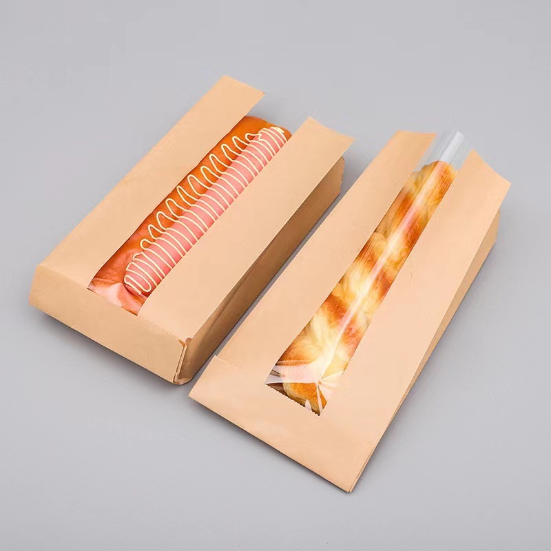 French baguette paper bags are specifically designed for carrying long, slender loaves of bread. They are made of durable cowhide paper, ensuring the bread stays fresh and protected during transportation. The bags feature a unique open-window design, allowing customers to easily see the bread inside without the need to open the bag. This also helps to showcase the bread and entice potential buyers. The bags are typically long and narrow, perfectly fitting a standard French baguette. They are also lightweight and easy to carry, making them ideal for bakeries and food stalls. Additionally, the bags are eco-friendly and can be recycled after use, promoting sustainability in the food industry.