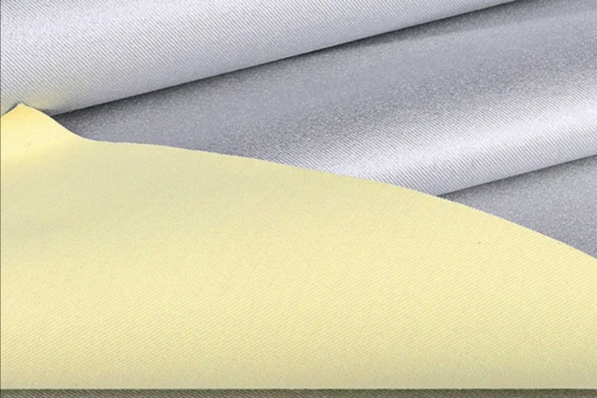 Tela compuesta de aramida y plata