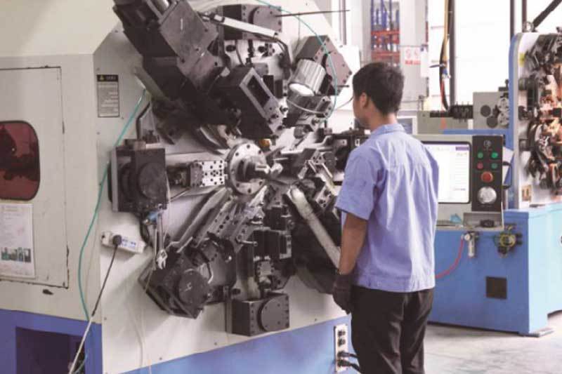 Automatic spring coiling machine