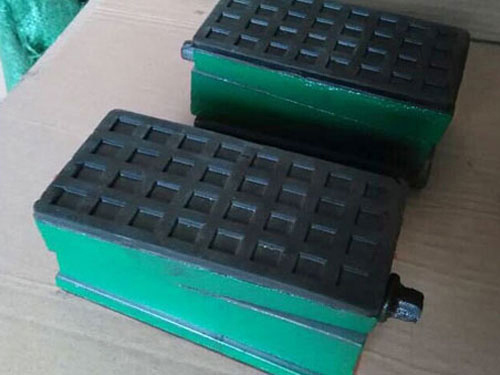 Three layer shock-absorbing pad iron