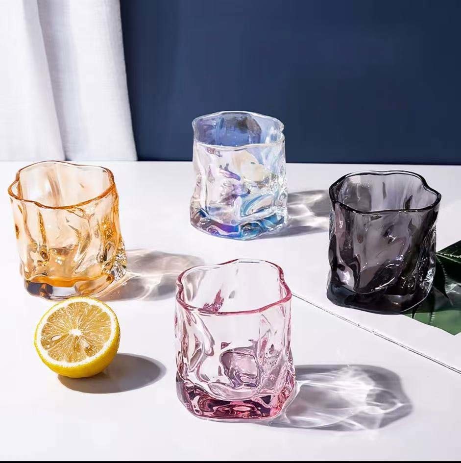 Transparent glass irregularly twisted cup