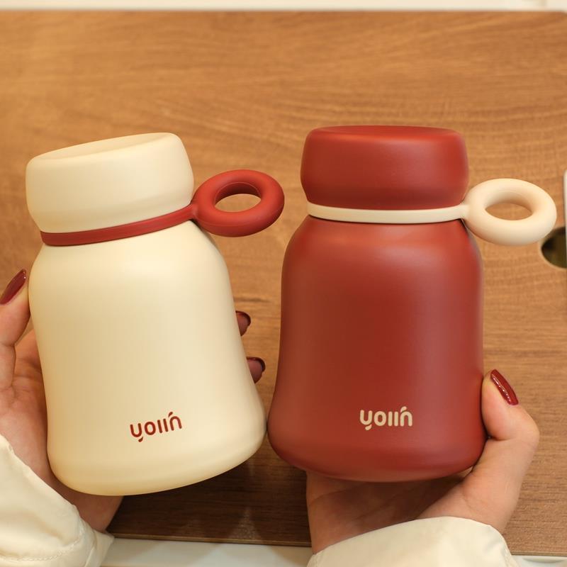 Small, bell-shaped insulated cup