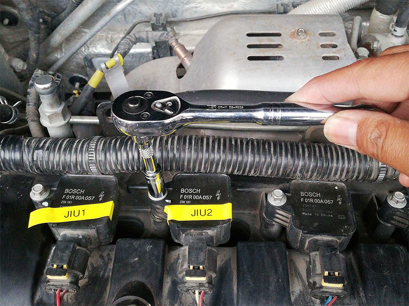 What are the faults caused by a damaged ignition coil in a car?