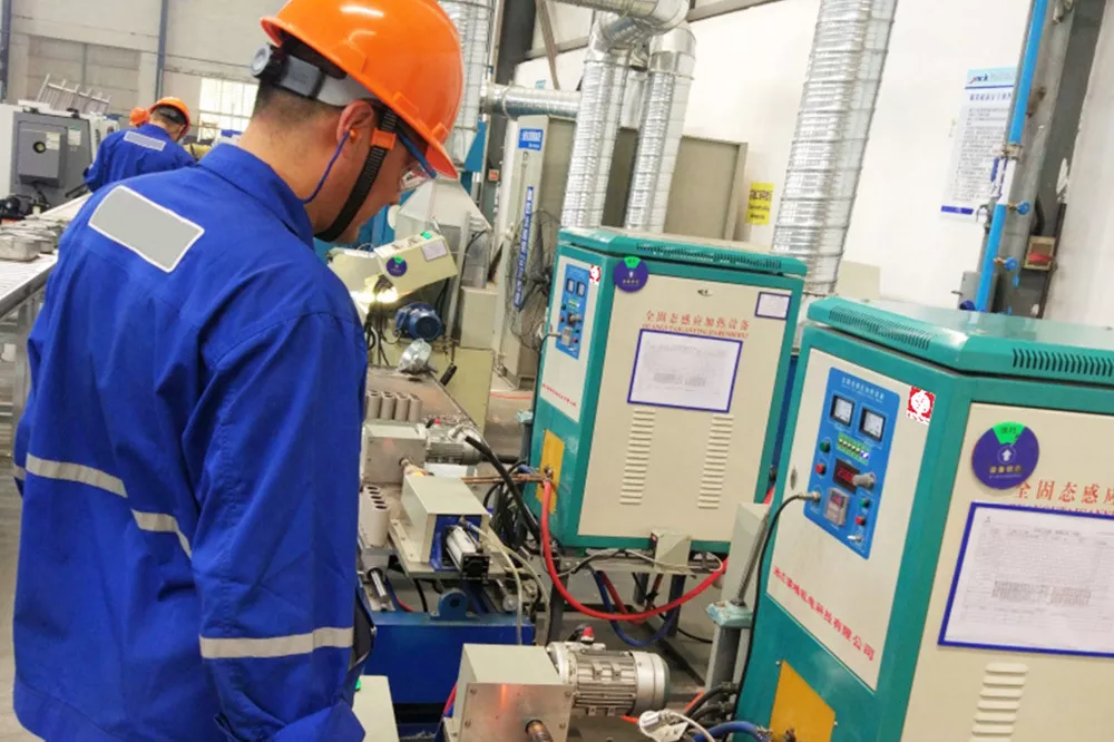 Production equipment for spray welding and remelting of oil couplings.