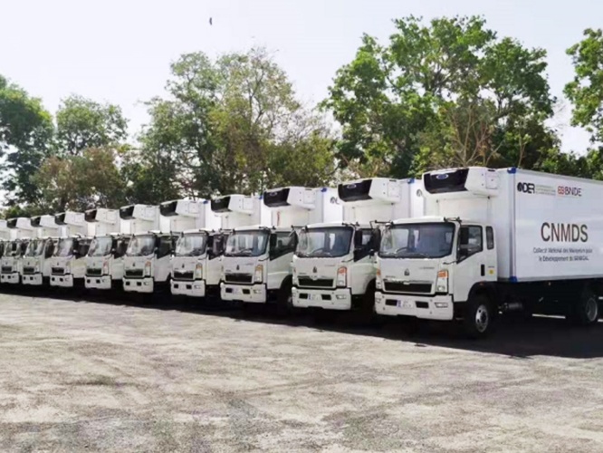 The assembled vehicles of Sinotruk's Senegal SKD factory are neatly placed on the site, waiting to b...