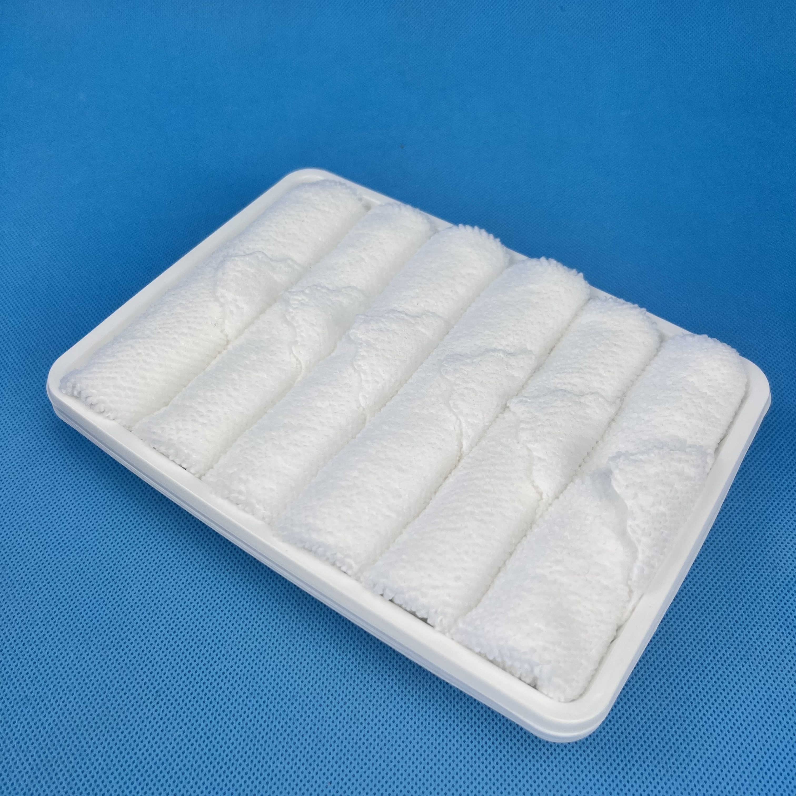 Rolled White Microfiber Hot and Cold Disposable Face Aviation Towel in Tray