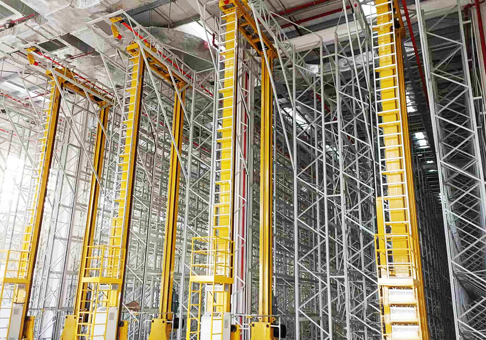 Système automatisé de stockage et de récupération par pont roulant