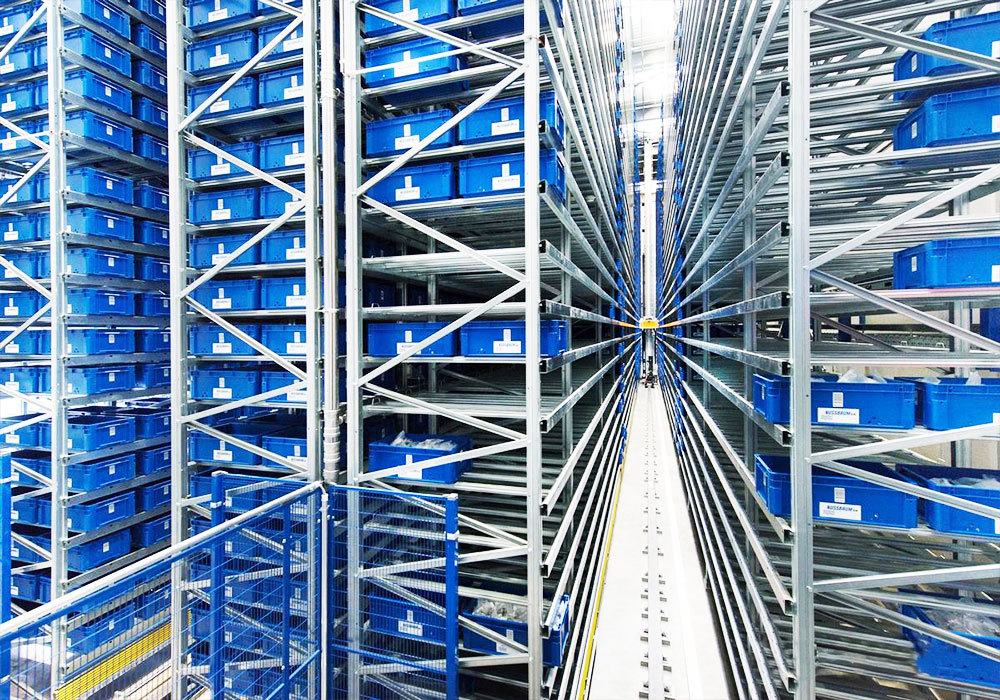 Système automatisé de stockage et de récupération par pont roulant