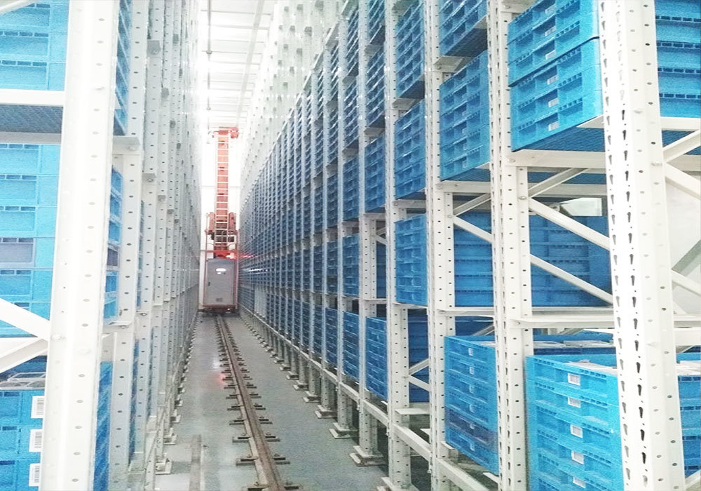 Système automatisé de stockage et de récupération par pont roulant