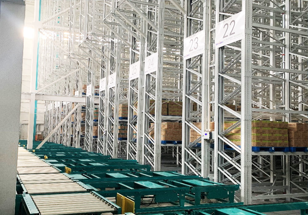 Système automatisé de stockage et de récupération par pont roulant