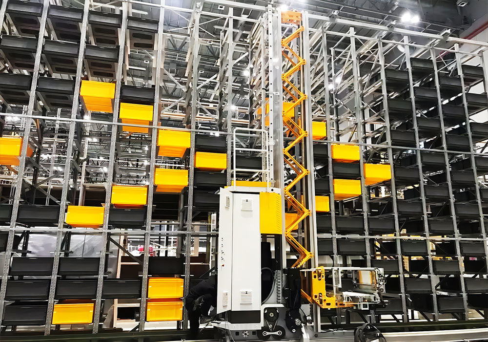 Système automatisé de stockage et de récupération par pont roulant