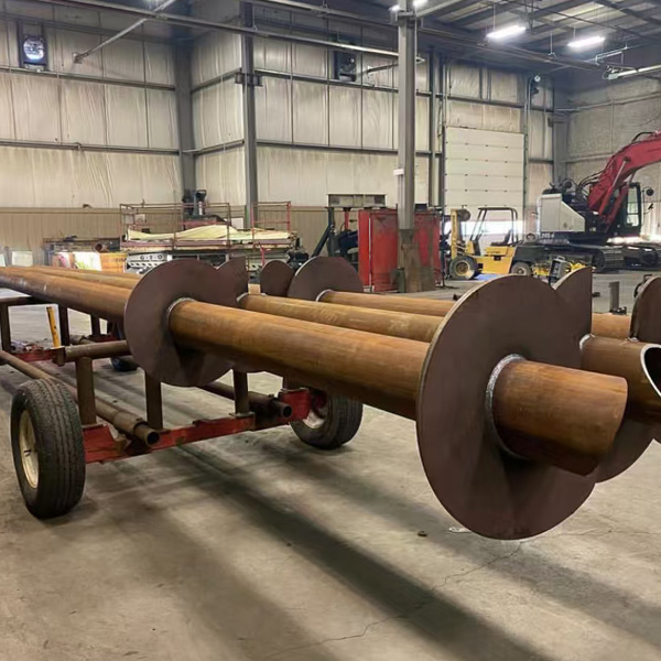 Double blade spiral ground piles for bridge support