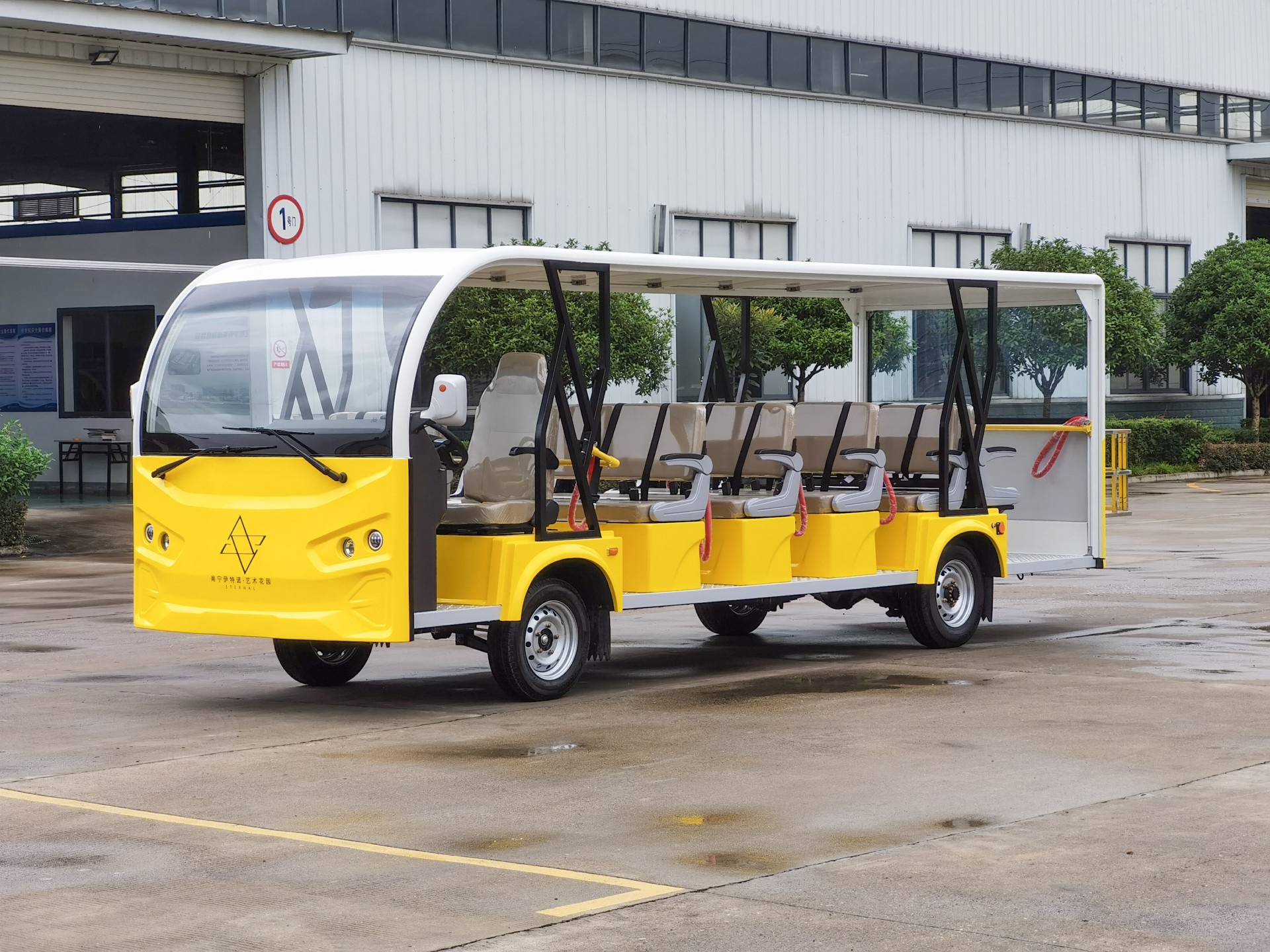 [23-seat K open-top white above yellow external cargo frame]