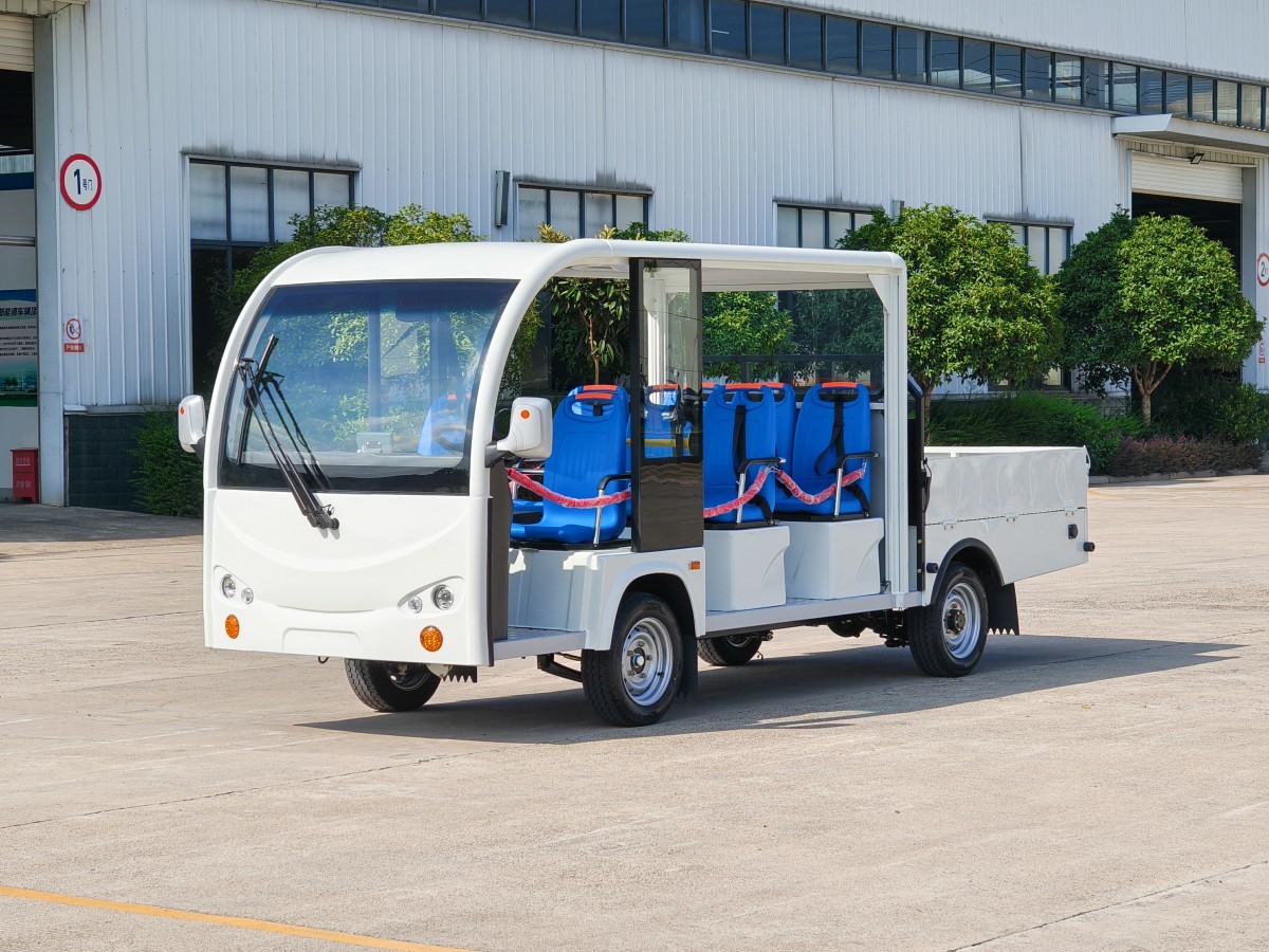 [1T cargo box T open public bus seats three rows]