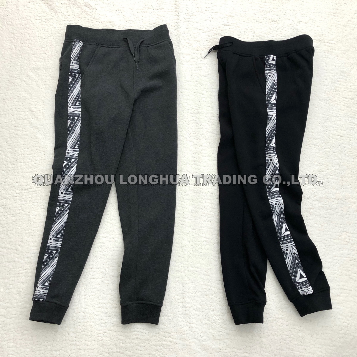 Men′s and Boy′s Joggers Knitwear Casual Jogging Pants Trousers Apparel Kids Wear with Printing Joint Panel Polyester Fleece Joggers