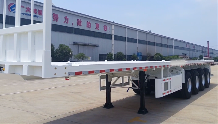 Four-axle flatbed semi-trailers are exported in bulk to Africa, supporting local infrastructure and logistics.