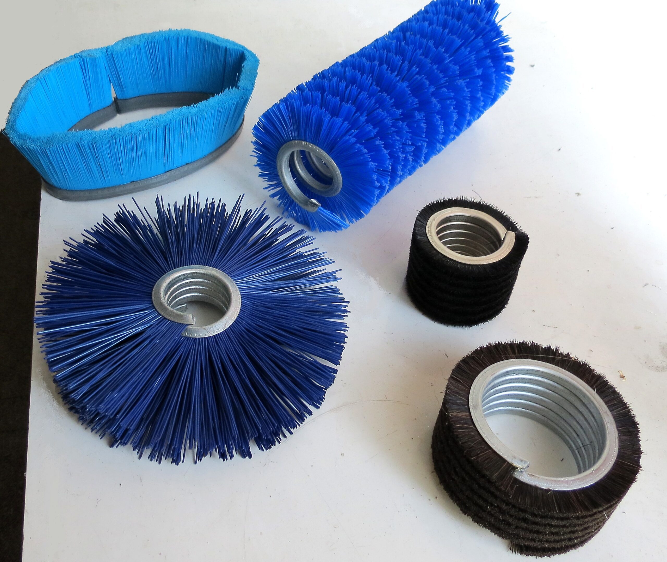 Helical brush coil
