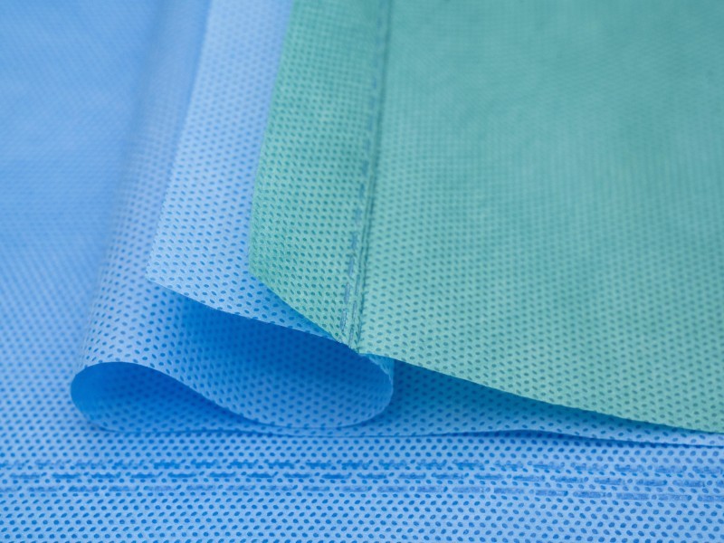Dual bonded SMS wrap