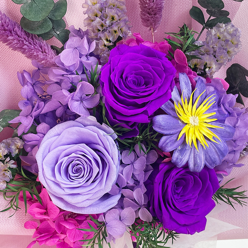 Close-up of preserved rose petals and floral arrangement