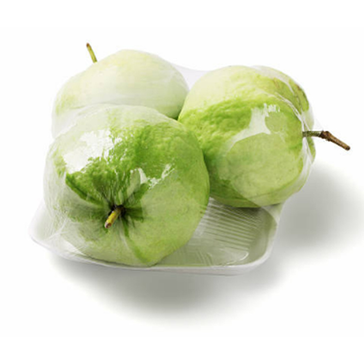 Fruit trays packed in stretch film