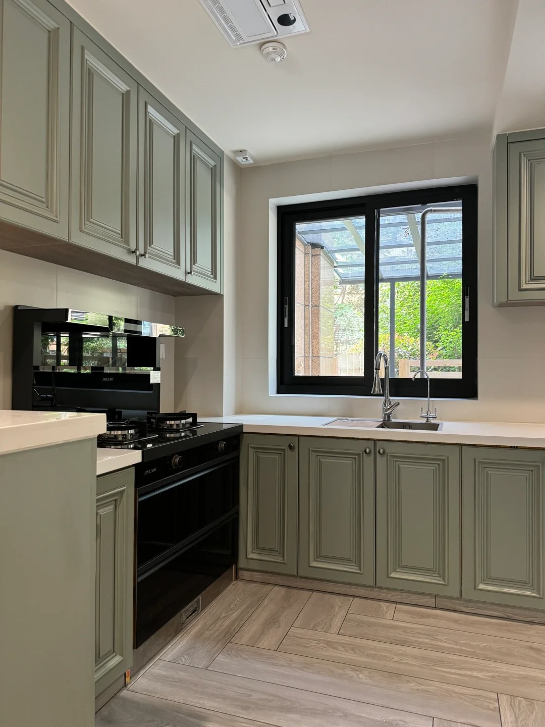 green kitchen with white top(1746687540488).jpg