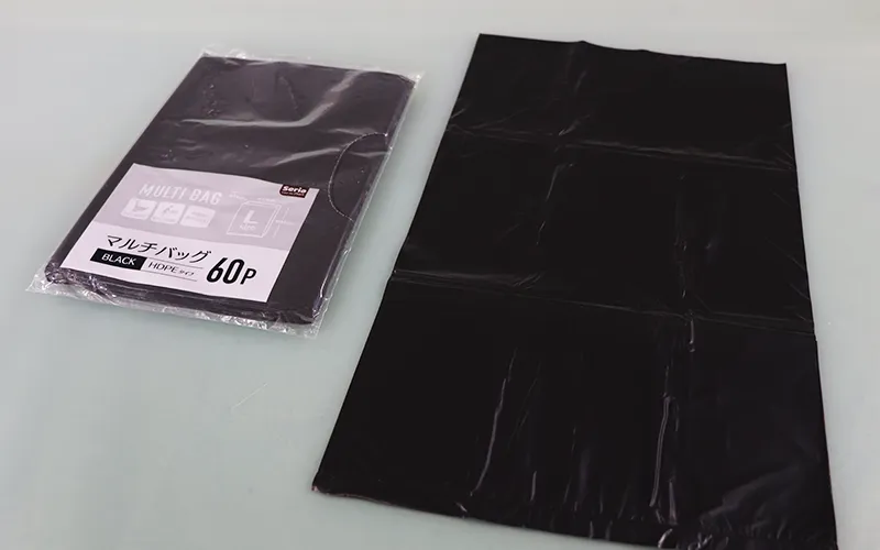 What is the price difference between plastic garbage bags made of different materials?
