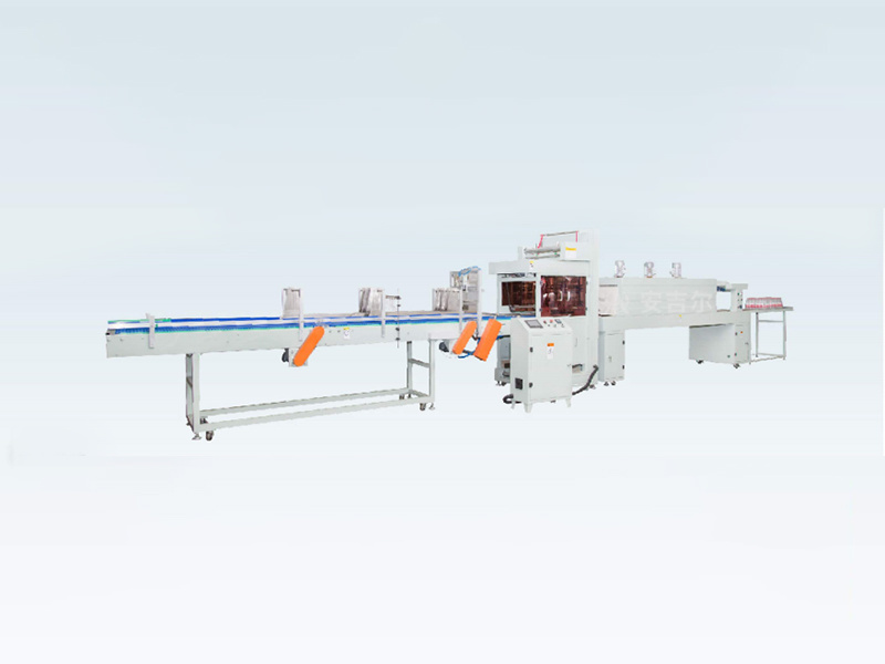 In-line film wrapping machine