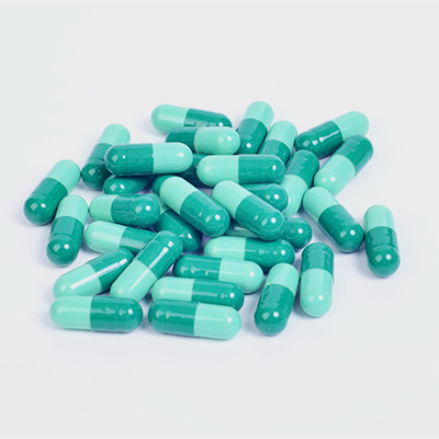 Colonized hollow capsules Colonized hollow capsules
