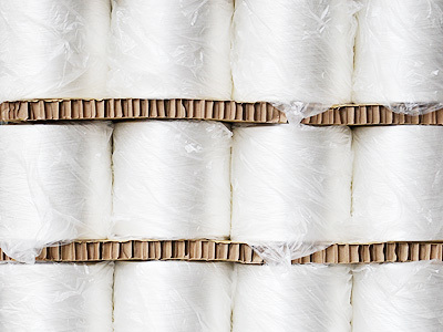 Activated polyester industrial filament