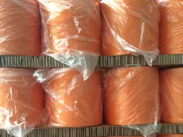 Orange polyester industrial filament
