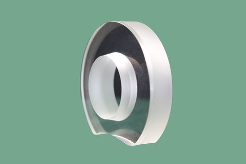 Arc-shaped aperture center perforated lens