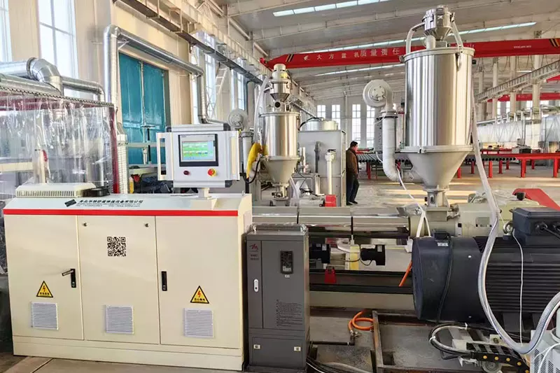 Extruder and extruder control cabinet