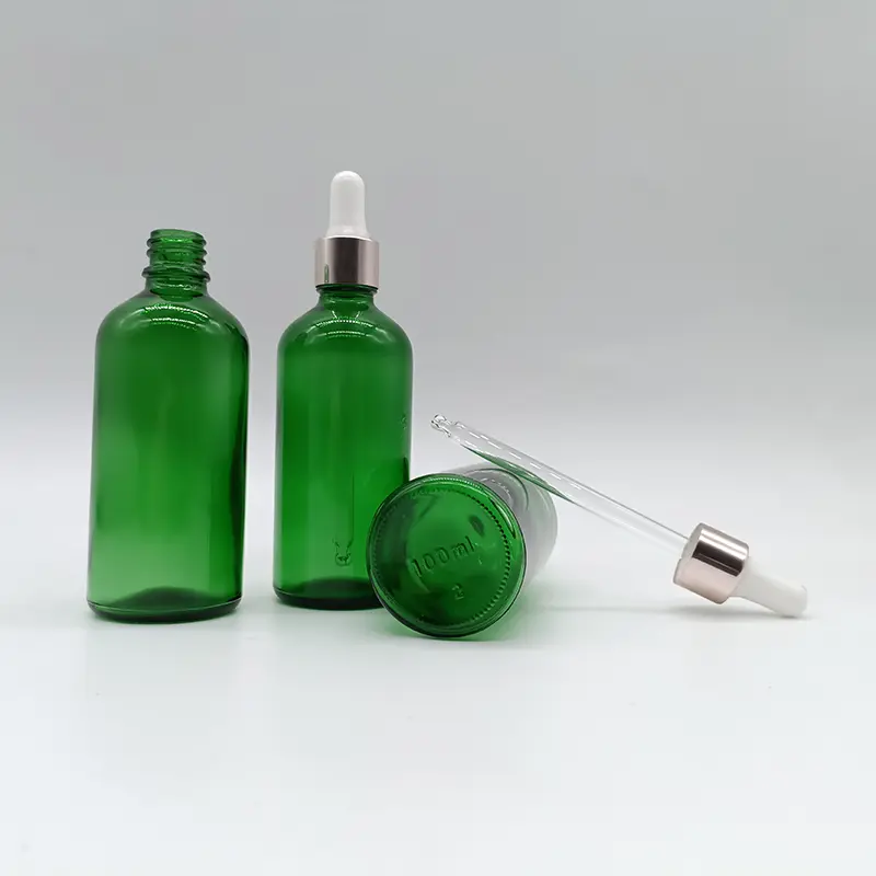 Frascos de vidrio verdes para aceites esenciales