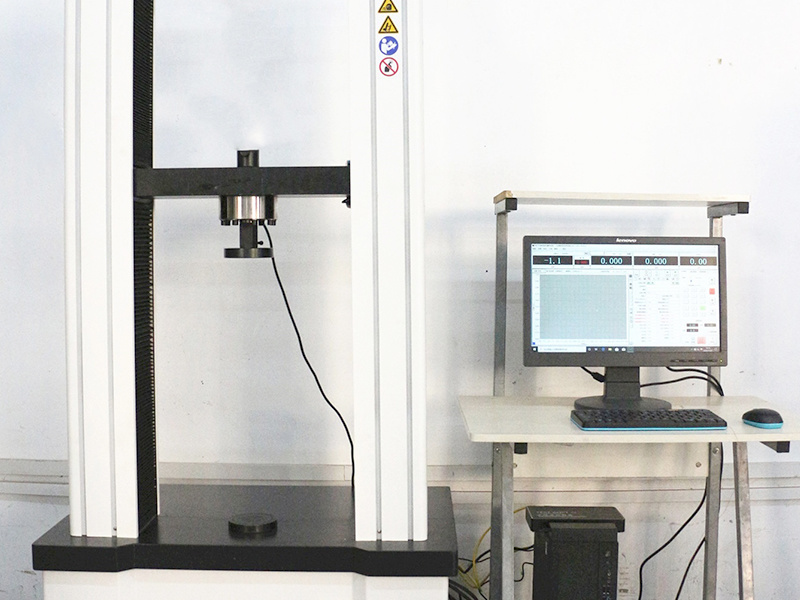 Tensile and compression testing machine