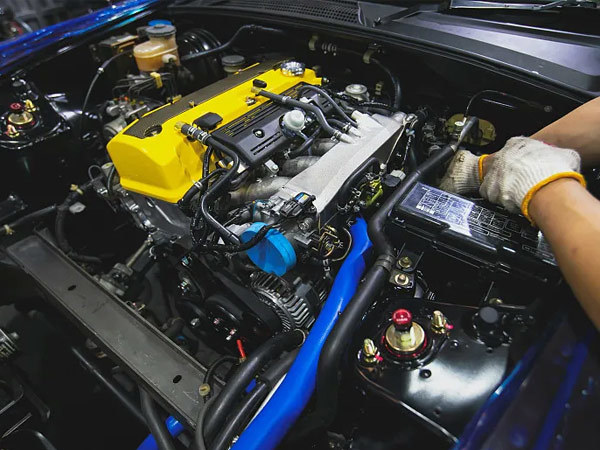 What is the function of the engine cooling system? What are its main components?