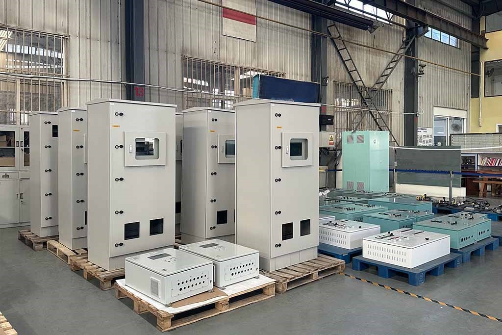 Factory Workshop with Neatly Stacked Electrical Enclosures and Control Panels​