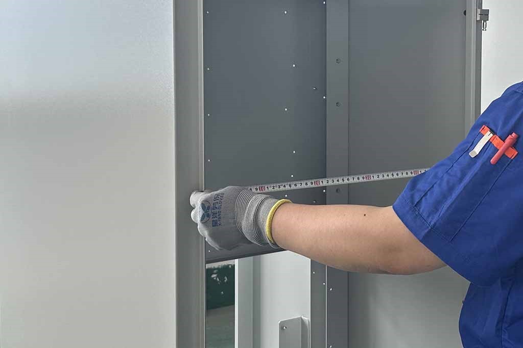 Tape Measure Checking Cabinet Width​