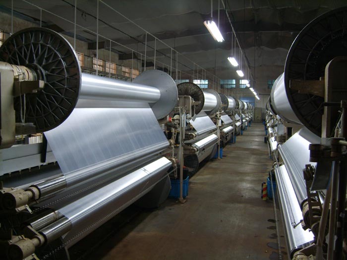 A corner of the water-jet double warp beam shading cloth workshop
